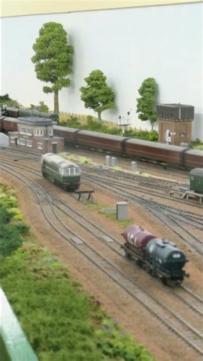 1960 - Southern Steam Okehampton Car Carrying Train rushes through Ewhurst Green (model railway)