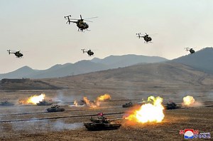 North Korean Battle Tanks Roll Across Field in Drills Led by Kim