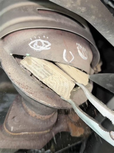 The Smile Cut Technique for Catalytic Converter Repair