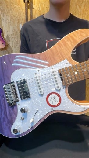 Nuance Lab Music Boutique on Instagram: "Shijie TM4 - Alfafa - 2025 - Curly Maple Figure This Shijie guitar features a three-piece Alder body with a stunning Quilted Maple top, finished in a unique Alfalfa Purple. The White Pearl pickguard adds a touch of elegance to its appearance. The neck is crafted from Roasted Quarter Swan European Maple, reinforced with a built-in carbon fibre rod for added stability. The Rosewood fingerboard, along with a SHIJIE thin “C” profile and a 42mm bone nut, provi