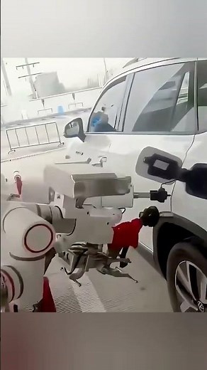 Chinese robots refuelling cars at the filling station