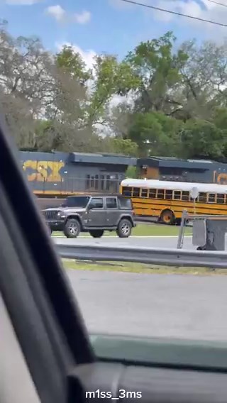 Another angle of the near train collision of a school bus in Sumter County, Florida has been postedEarlier footage from inside the school bus showed the kids yelling as they almost got hitSumter County Sheriff's Office said Yvonne Hampton is accused of 29 counts of child neglect and one count of endangering an adult