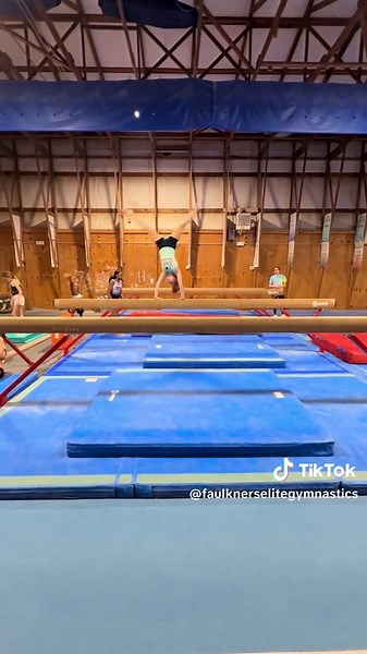 Zoey Works on Cartwheels on Beam