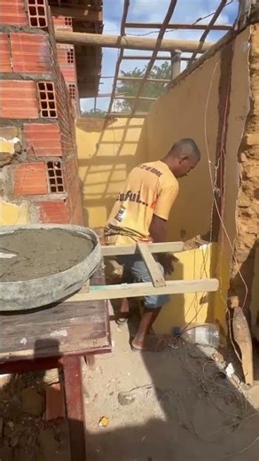 The bricklayer made space by knocking down the wall to accommodate the scaffolding.