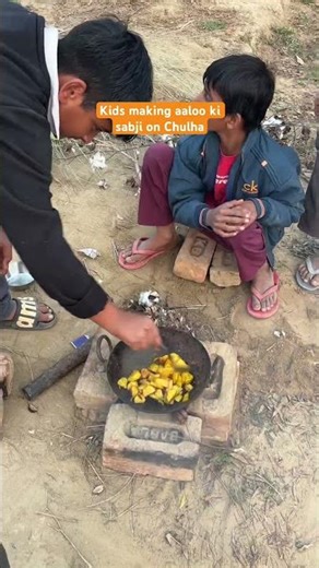 Kids making aaloo ki sabji on Chulha