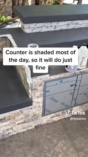 Epoxy over this concrete counter for a bbq area 🔥 we glued the tape to the edges to ensure the epoxy wont leak. Had to work fast! #epoxy #epoxycountertops #itsepoxy #stonecoatcountertops #outdoorcooking #california #remodel #renovation #fyp
