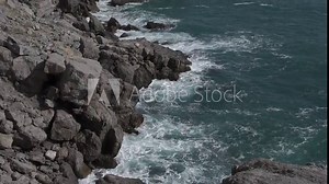 Waves crashing on rocks. East-South Crimea coast of Black Sea. Sudak Nature Reserve.