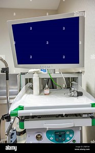 Modern endoscopy equipment kit. Electronic video Endoscopy System. A patients couch and a stand with a gastroscope and a monitor Stock Photo - Alamy