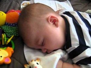 Baby having a bad dream and crying in his sleep