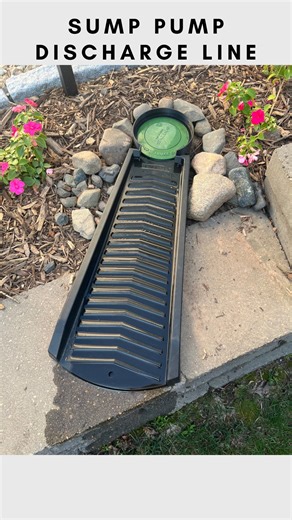 Sherry | Design & DIY on Instagram: "Vinyl splash block + 3D printed round water collector. Our solution to diverting water from the pop up emitter to the other side of the retaining wall. 💁🏻‍♀️ Hopefully this will slow down the erosion and keep our retaining wall safe and sound for the long haul 🙌 #diyhomeprojects #yardwork #drainage #outdoorproject"