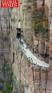 Watch with wonder! Only if you are brave enough, try driving on one of the world’s most dangerous roads. The 1,300-meter-long road carved through a cliff edge, called the Guoliang cliff corridor, was a complete manual construction by the inhabitants of Guoliang village in Central China’s Henan Province. The construction of this miraculous road took 5 years, from 1972 to 1977. | Global Times