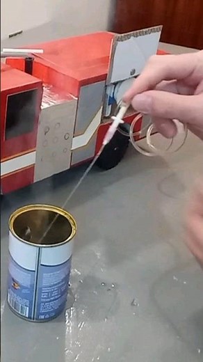 My cardboard fire engine in action