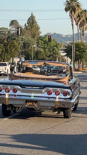 106K views · 4.7K reactions | 1963 Chevy Impala RAG TOP LOWRIDER TIPPING on 3 wheels on Van Nuys Blvd!  (until the golf cart guys told him to move along)  | Skid Society | Facebook