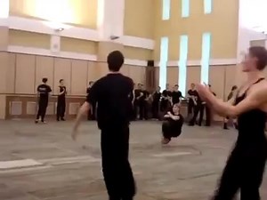 Russian guy squat kick dancing insanely fast