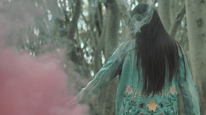 Woman walking in the forest - Free Stock Video