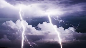 Super slow motion lightning flashes across heavy storm clouds, capturing the dramatic pulse of nature fury in stunning detail.