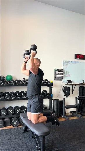 ELEVATED KNEELING DOUBLE KB BOTTOMS UP SHOULDER PRESS