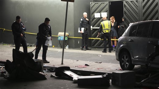 Man whose car struck crowd outside LA club, injuring 30, was shot, attacked by crowd