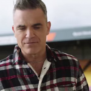 17K views · 460 reactions | "I've looked back and taken stock of what's happened, where I've been... and it's given me a sense of pride and well-being." Robbie Williams joins Zane Lowe for a special conversation to reflect on his 25-year solo career from 'Life Thru A Lens' to 'XXV.' Watch: apple.co/-RobbieZL | Apple Music | Facebook