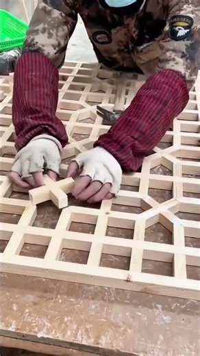 installing wood pieces on window frame manually using wooden mallet to achieve very neat results