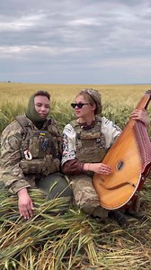 465K views · 10K reactions | In the video, well-known Ukrainian singer and bandura player Maryna Krut and paramedic Iryna Tsybuh. They have just returned from Chasiv Yar, a town near Bakhmut, and are singing 'Contra spem spero' by the genius Ukrainian author Lesia Ukrainka at one of the fields in Donetsk Oblast. Invincible women  : bandura_krut (Instagram) | UkraineWorld | Facebook