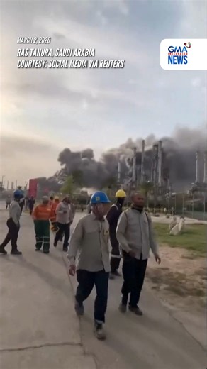 WATCH: Eyewitness footage filmed on Monday, March 2, 2026 showed workers evacuating the area around the Ras Tanura oil refinery as smoke rises behind them, following a reported Iranian drone strike. Reuters verified the location from the buildings, trees and the smoke stacks seen in the video, which matched satellite imagery of the area. The date was verified from an official statement from Aramco saying it had shut the facility down after a drone strike on March 2. COURTESY: Social Media via Re