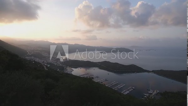 A panorama of the tourist city of Kas at sunrise. Mediterranean beaches. Antalya city, Turkey country - 4k video