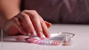 Palette of gel polishes, choice of nail polish color on palette. Browse and select nail polish colors from a diverse gel polish palette, close-up.