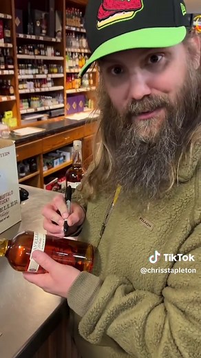Signing bottles of #TravellerWhiskey. 🥃 | chris stapleton
