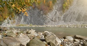 Beautiful autumn nature. The Prut river and mountain folds in Yaremche City, Carpathians, western Ukraine, known as Yaremche folds - biggest outcrop of Stryi formation in Europe