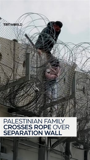 A Palestinian family with young children is seen crossing a rope over the separation wall in the occupied West Bank, a shocking image highlighting the daily movement hardships families face under Israel's apartheid restrictions. | TRT World