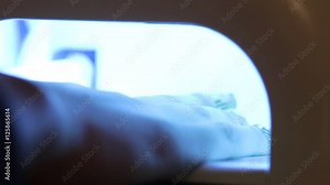 Master makes the girl manicure hands at salon