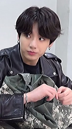 Jungkook's Stylish Backpack and Snack Essentials