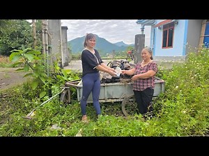 Girl repairs and restores the 4102 engine of a broken and rusted old car.
