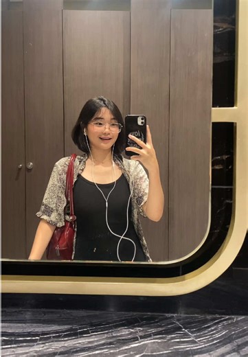 Mirror Selfies: Capturing Moments in a Modern Restroom