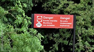 Danger sign: undetonated explosives. Danger sign at World War I battleground in France.