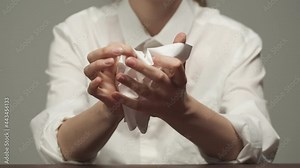 Young woman wearing white shirt crumpling a paper into ball and throwing away. A businesswoman in formal clothes crumples a blank sheet in office. Stock Video