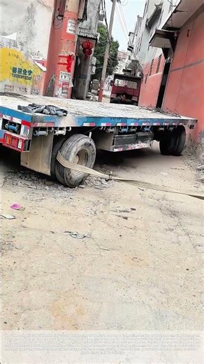 Towing a Stuck Flatbed: How a Car Maneuvers a Trailer Through a Narrow Alley