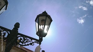Historic lantern in front of historical building in Europe