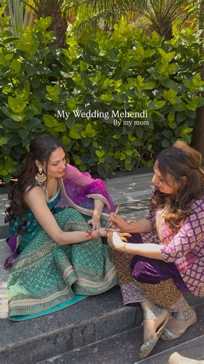 Stuti Vora on Instagram: "I wanted my wedding mehendi to feel like me, and there was no one else I’d rather have do it than my mom! 🥹🧿 I wanted it grounded, minimalist, and most importantly, meaningful. She hand-drew our wedding logo—the Trinity Celtic knot. Having her do it made the whole process feel so much more personal and sacred. 🤍 Outfit : @jesalvoraofficial Earrings : @jesalvoraofficial [ Indian Bride, Indian Wedding, Mehendi, Bride , Explore page] #IndianWedding #Mehendi #bride #indi