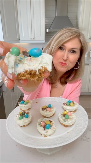 Mini Easter Cheesecakes They are no make and so simple to make. Here’s what you need..Crust - 1 cup graham cracker crumbs 1/4 cup salted butter (I also add 1 tbsp or 2 of dark brown sugar) - pat down into your silicone baking cups and place in fridge while you make your filling. Filling - 1/2 cup whipping cream (heavy cream) 8oz cream cheese 1/3 cup powdered sugar 1 tbsp sour cream squeeze of lemon 🍋 (1tsp) 1 tsp vanilla extract 3/4 cup crushed Mini Easter Eggs (save some of the pieces for the 