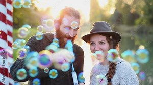 Blowing bubbles at sunset