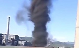Anti-cyclonic whirlwinds seen on video towering into sunny sky