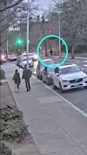 Brown University suspect walks past police officers after shooting