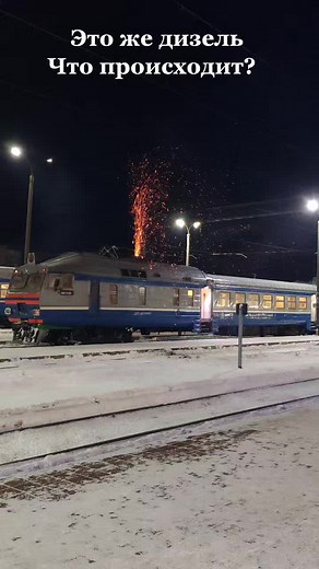 Nighttime Train Fireworks Display in Snowy Landscape