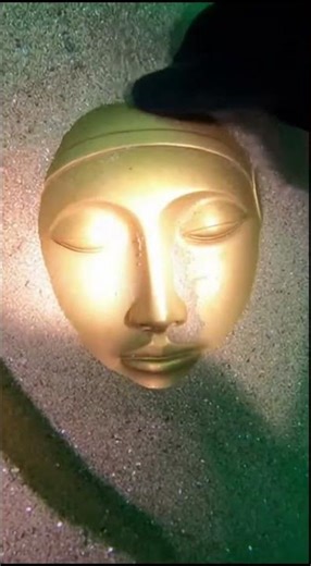 The mask of the deep A diver discovers an ancient bronze mask hidden beneath the ocean sands,