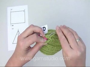 In this video we show how to fold the very popular "Edith Piaf" hat, where to sew and how to attach the band. Have you made this hat? Show us with a photo here on Facebook! To see the pattern to this hat, see: http://www.garnstudio.com/lang/en/pattern.php?id=5285&lang=en Press the HD button right on the video menu to see the video in high resolution. If you have a question regarding this video, please leave it here: http://www.garnstudio.com/lang/en/video.php?id=419 There are more than 650 DROPS