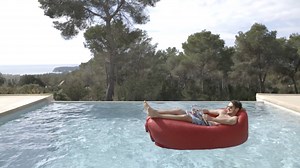 This inflatable sofa folds into a backpack. | Insider