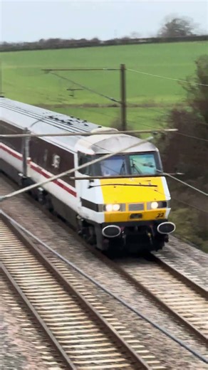 LNER Class 91 passes under a bridge at high speed