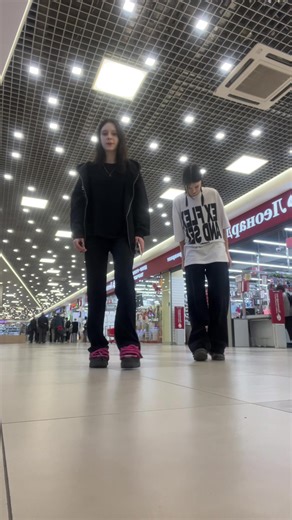 Dance Routine in a Modern Shopping Mall Setting